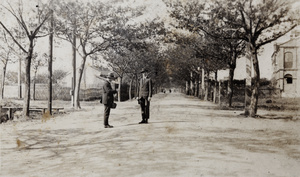 Bill Hutchinson standing with another man in Tongshan Road, Hongkou, Shanghai