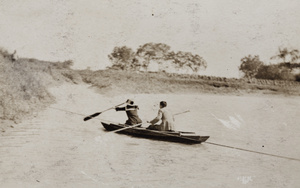 Man and woman paddling a punt, Shanghai