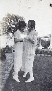 Two young women dancing in the garden, 35 Tongshan Road, Hongkou, Shanghai