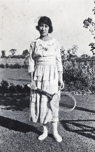 Edie Gundry with a tennis racquet, 35 Tongshan Road, Hongkou, Shanghai