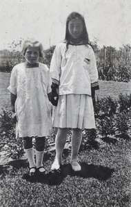 Maggie Hutchinson with neighbouring girl in the garden, 35 Tongshan Road, Hongkou, Shanghai