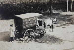 Woman at the back of a Hall & Holtz horse-drawn delivery cart, Tongshan Road, Hongkew, Shanghai