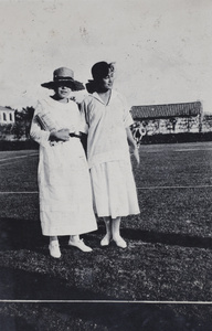 Gladys Gundry and an unidentified woman on the tennis lawn, 35 Tonghsan Road, Hongkou, Shanghai