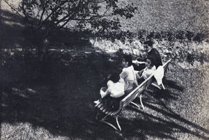 Charles Hutchinson with three women watching tennis, 35 Tongshan Road, Hongkou, Shanghai