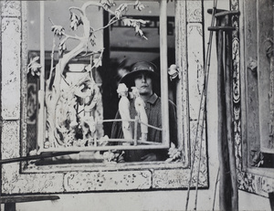 Fashionable woman photographed through a carved screen, Hangzhou