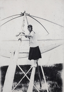 Lily Yoo standing on a fishing drop-net, near Shanghai