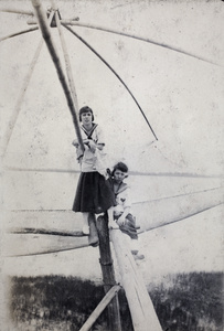 Lily Yoo and another woman, posed on a fishing drop-net, near Shanghai