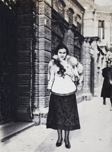 Young woman wearing Chinese-style jacket and fox fur stole, Shanghai