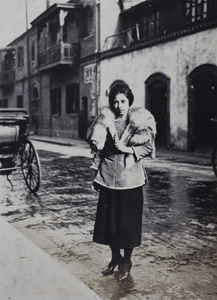 Young woman wearing Chinese-style jacket and fox fur stole, Shanghai