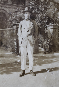 A young man in front of entrances to residential buildings, Shanghai