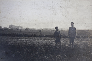 Fred and Dick Hutchinson standing in a field, Hongkou, Shanghai