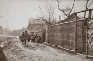 Porters, women, and children on Kwenming Road, Hongkou, Shanghai