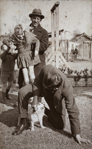 John Piry and Bill Hutchinson playing with the neighbouring children, 35 Tongshan Road, Hongkou, Shanghai