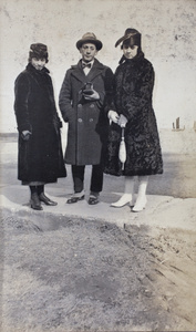 John Piry with two unidentified young women, Wusong, February 1920