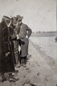 Tom Hutchinson with two young women on a stone jetty, Wusong, February 1920