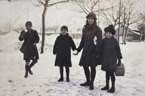 Dick, Fred and Maggie Hutchinson, standing with Nora on a snow covered Tongshan Road, Hongkou, Shanghai, February 1919