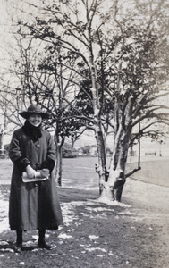 Hannah wearing winter coat, in the Public Garden, Shanghai