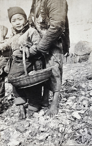 Boat-dwelling child and adult on river bank, Shanghai