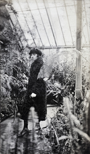 Young woman in the Sincere Department Store roof garden glasshouse, Shanghai