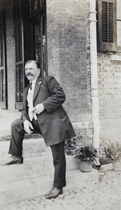 Mr Belyea standing at the steps to the verandah, 35 Tongshan Road, Hongkou, Shanghai