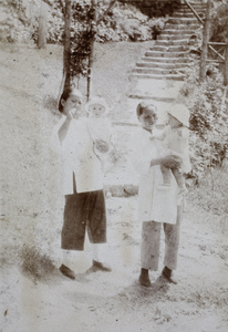 Two amahs carrying Sonny and Bea Hutchinson, Moganshan 