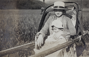 Sarah and Bea Hutchinson in a sedan chair, Moganshan