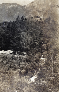 View overlooking an open air swimming pool and hill tops, Moganshan