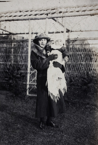 Margie Hutchinson holding Sonny in the garden, 35 Tongshan Road, Hongkou, Shanghai