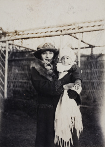 Margie Hutchinson holding Sonny in the garden, 35 Tongshan Road, Hongkou, Shanghai