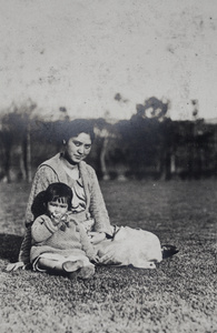 Bea eating a peach in the garden with Sarah Hutchinson, 35 Tongshan Road, Hongkou, Shanghai