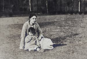 Bea eating a peach in the garden with Sarah Hutchinson, 35 Tongshan Road, Hongkou, Shanghai