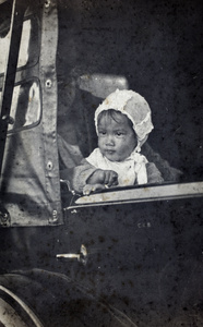 Bea in a bonnet sitting with Sarah Hutchinson in the back seat of an automobile, Wusong, 1923