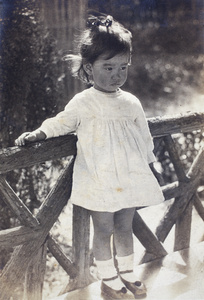 Bea Hutchinson standing in the garden summer house, 35 Tongshan Road, Hongkou, Shanghai