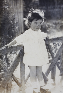 Bea Hutchinson standing in the garden summer house, 35 Tongshan Road, Hongkou, Shanghai