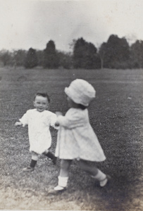 Sonny and Bea Hutchinson running in a park, Shanghai