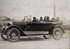 Charles and Margie Hutchinson and the Hansen family in a Crossley automobile with a uniformed driver, Shanghai