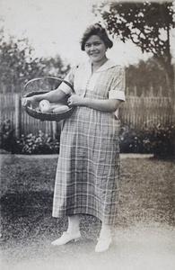 Hannah holding a basket of garden vegetables, 35 Tongshan Road, Hongkou, Shanghai