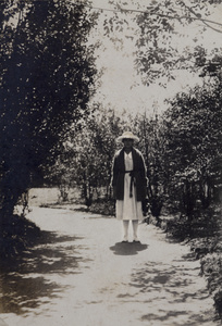 Sarah Hutchinson wearing a sunhat and cardigan, Shanghai