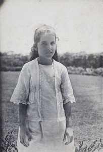 Unidentified girl, wearing a summer dress made with lace, in the garden of 35 Tongshan Road, Hongkou, Shanghai