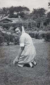Hannah kneeling on the garden lawn, 35 Tongshan Road, Hongkou, Shanghai