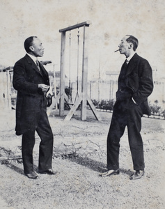 Two unidentified men smoking cigars in the garden, 35 Tongshan Road, Hongkou, Shanghai