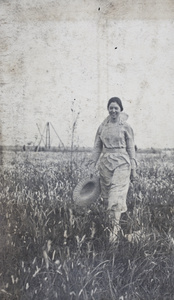 Sarah Penney walking through a field, Wusong, May 1921 