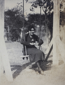 Hannah sitting on a garden swing, 35 Tongshan Road, Hongkou, Shanghai
