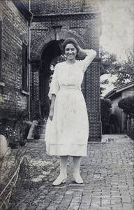 Sarah Hutchinson showing off a floral decorative detail on her dress, 35 Tongshan Road, Hongkou, Shanghai