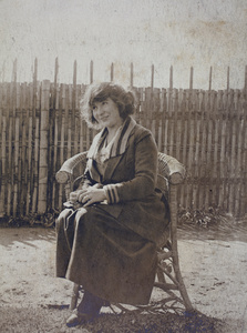 Mrs Koskey sitting on a garden chair, 35 Tongshan Road, Hongkou, Shanghai