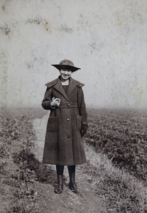 Sarah Hutchinson walking on a path beside fields near Tongshan Road, Hongkou, Shanghai