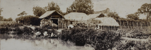 Men and women washing and drying laundry in a creek, near Shanghai