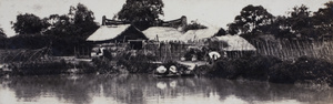 Men and women washing and drying laundry in a creek, near Shanghai