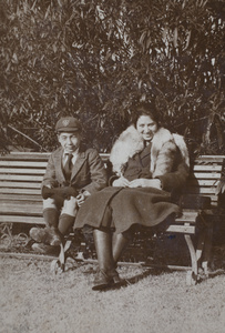 Fred and Sarah Hutchinson sitting on a park bench, Shanghai