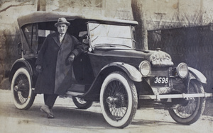 Charles Hutchinson leaning against his motorcar, Tongshan Road, Hongkou, Shanghai